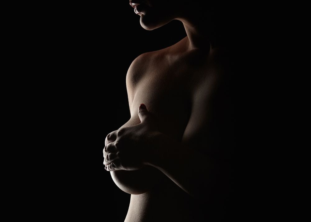 Silhouette of women performing breast massage